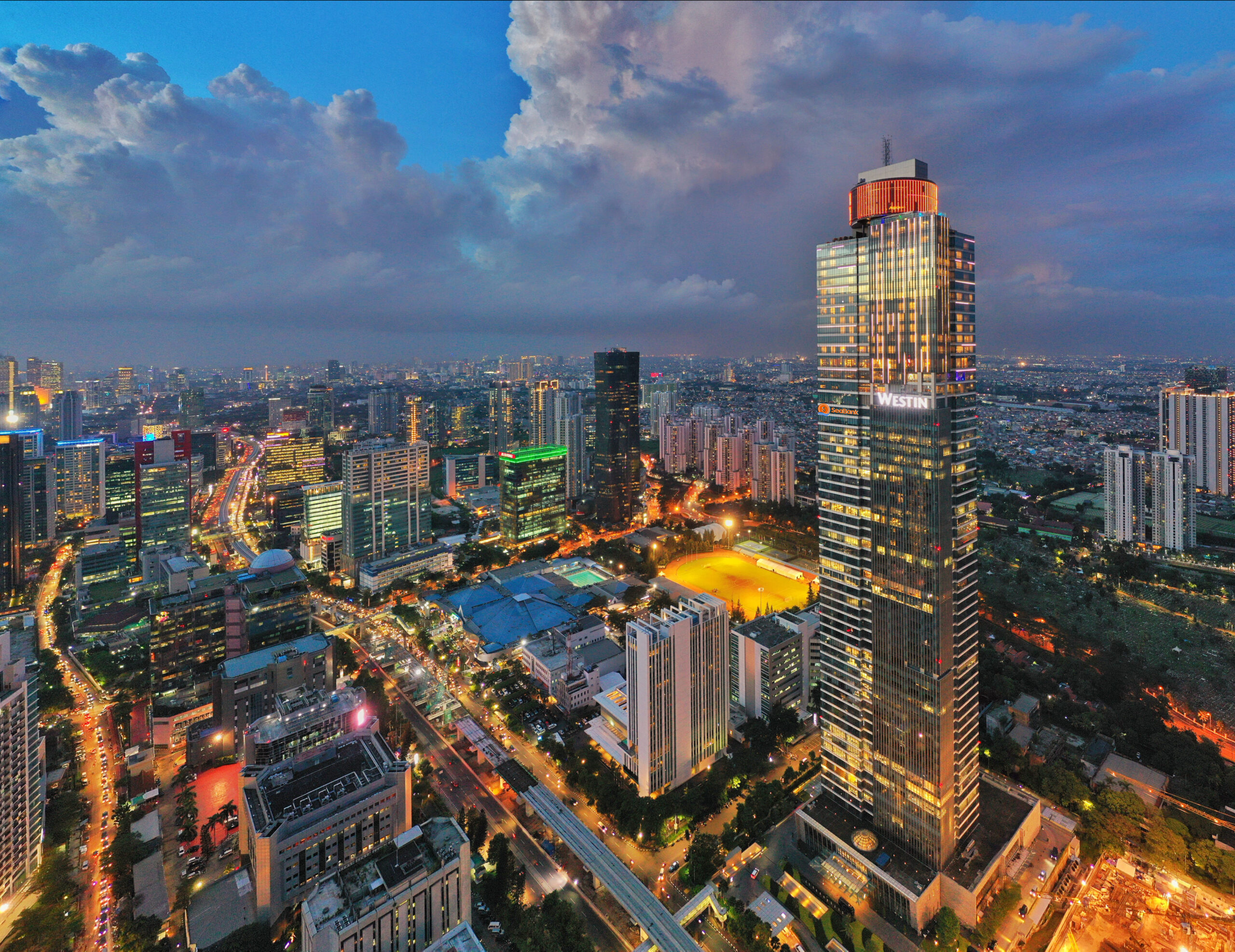 Gama Tower at dusk above the Jakarta skyline